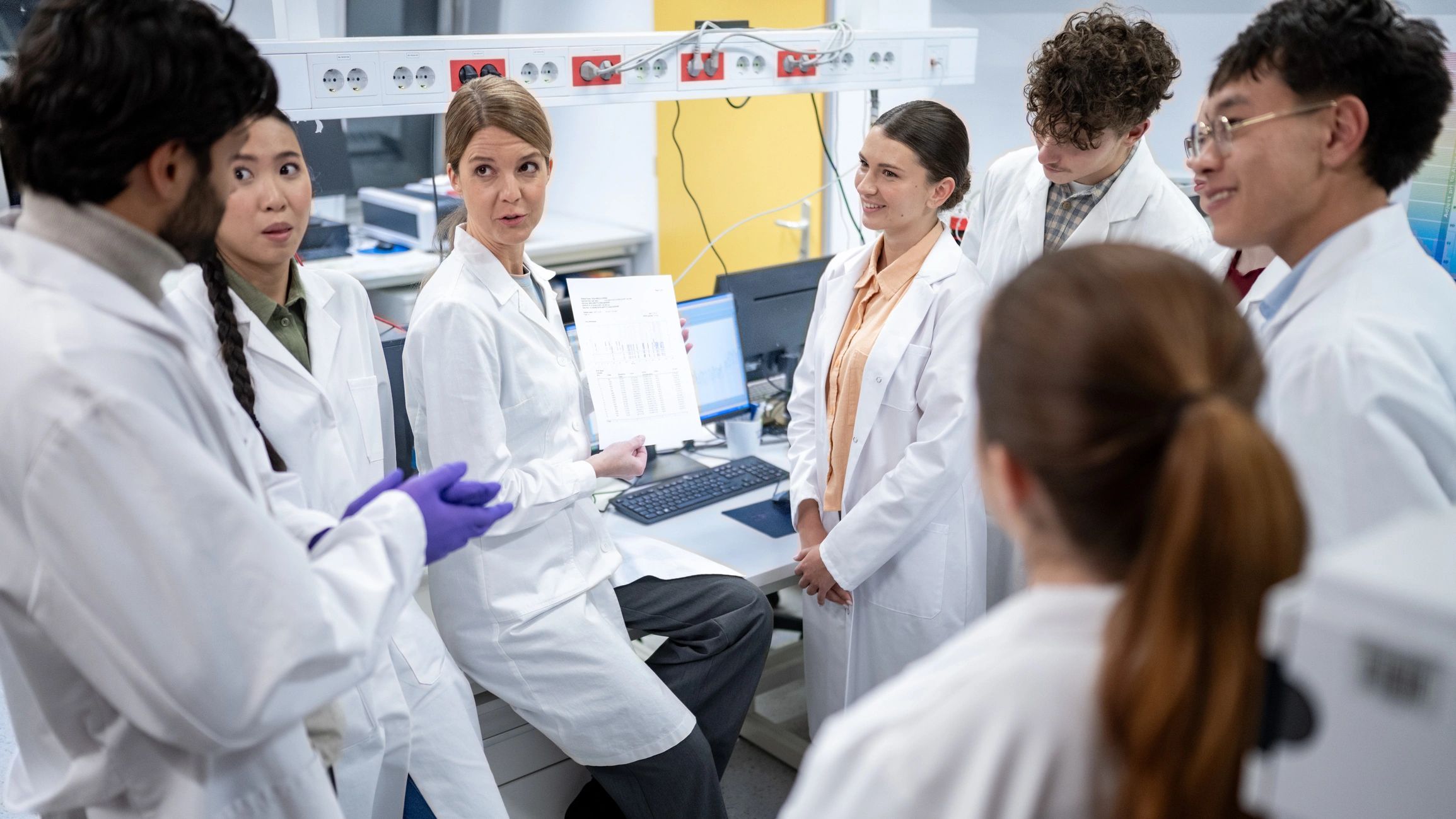 Scientists discussing research in a laboratory